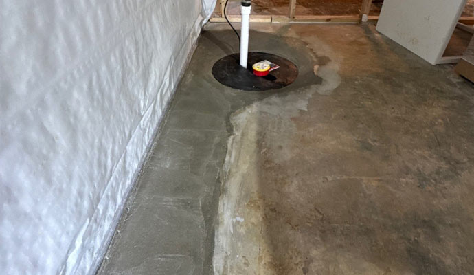 Basement drainage system installed with a sump pump