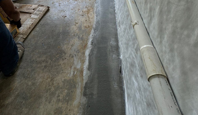 Basement waterproofing drainage system