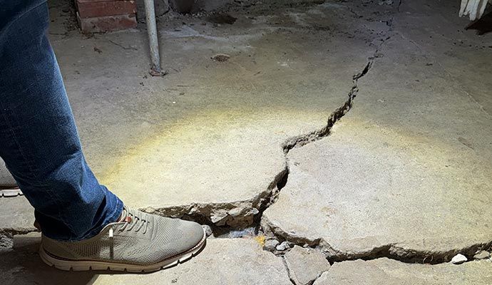 Cracked concrete floor in basement