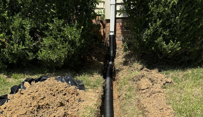 Downspout with underground drain pipe