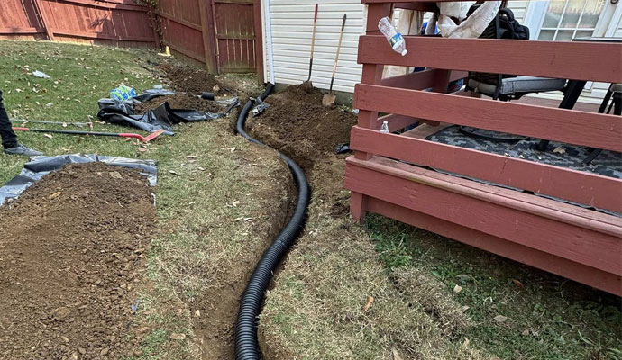 Exterior basement drainage system installation