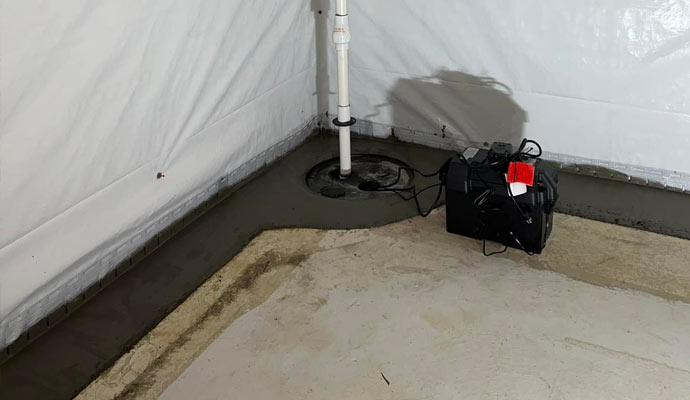 Sump pump installed in a fully waterproofed basement