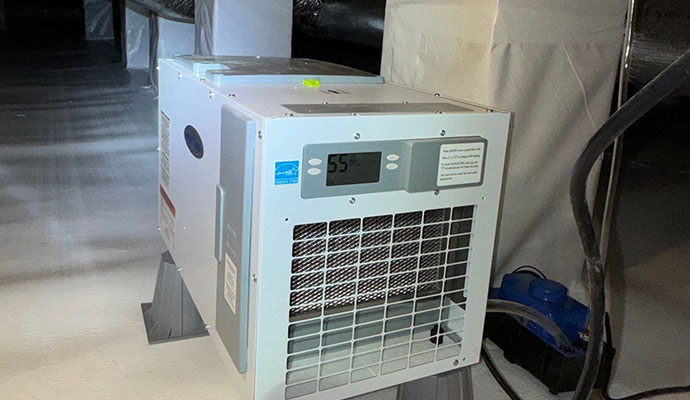 Dehumidifier installation for crawl space moisture control Dehumidifier installation for crawl space moisture control