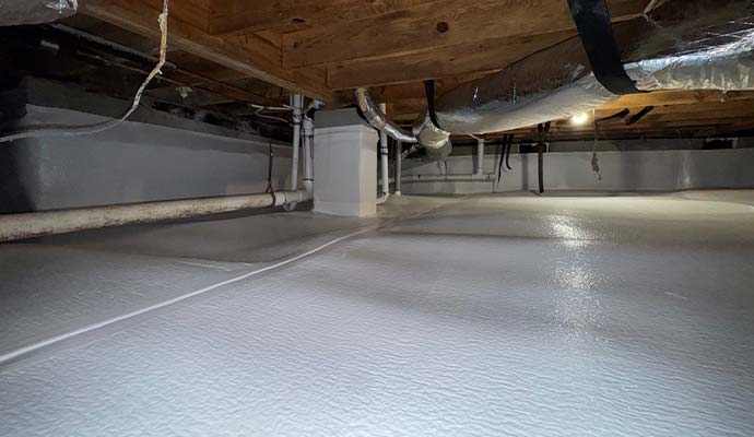 Waterproofed crawl space with white vapor barrier