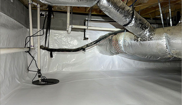 Clean encapsulated crawlspace with white vapor barrier and sump pump system