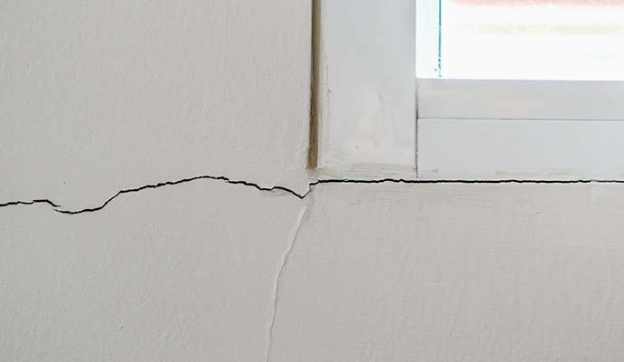 Drywall crack near window frame