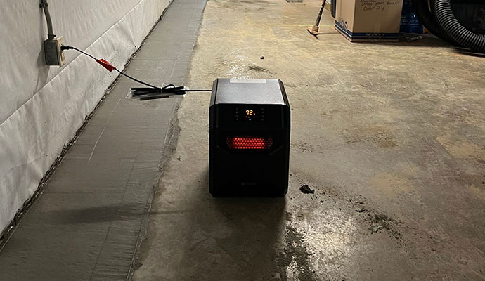 Space heater in basement  Space heater for waterproofing service in basement floor
