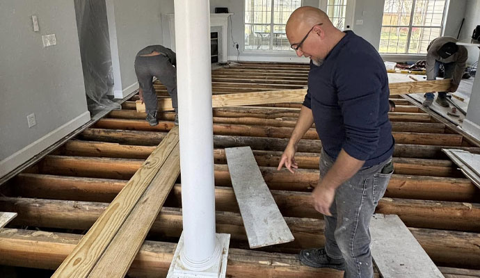 Wooden floor installation service Installing wooden flooring over exposed joists