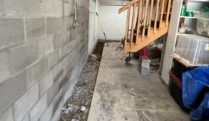 Interior french drain basement waterproofing
