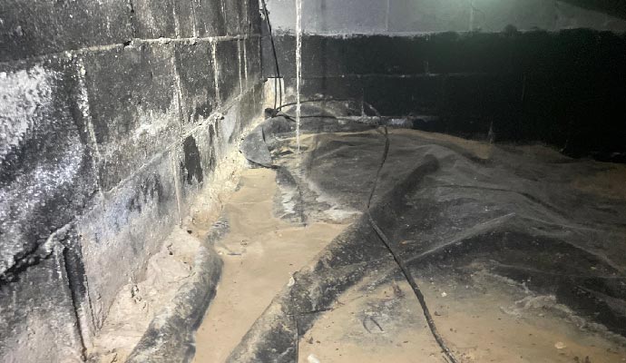 Leaking basement wall water damage