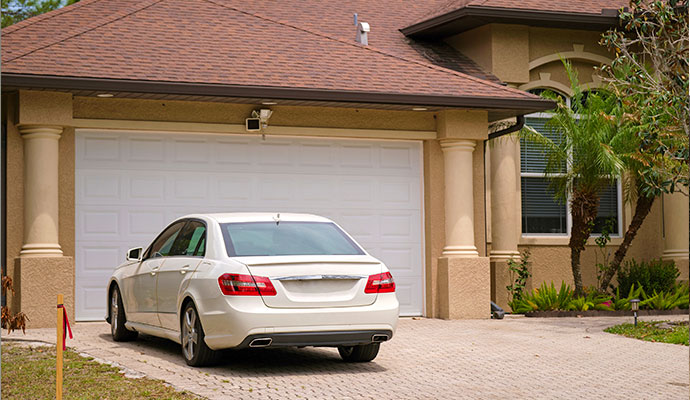 Car parked in front of a repaired garage lintel with LintelLift support system