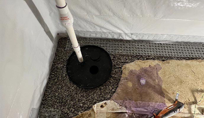 Sump pump basin and check valve installation