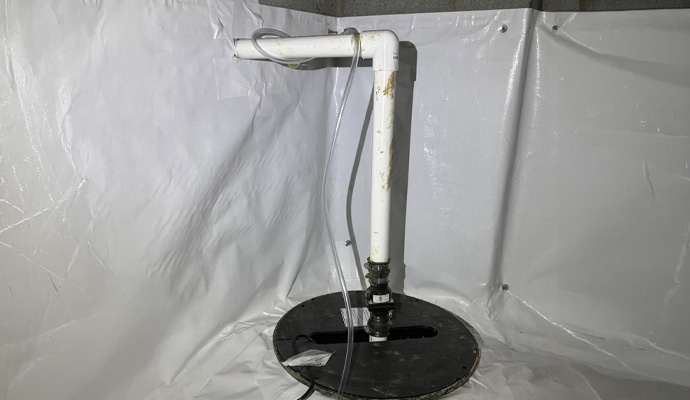 Sump pump system in encapsulated crawl space