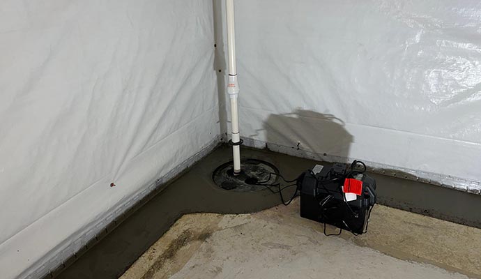 Installed sump-pump with battery backup system