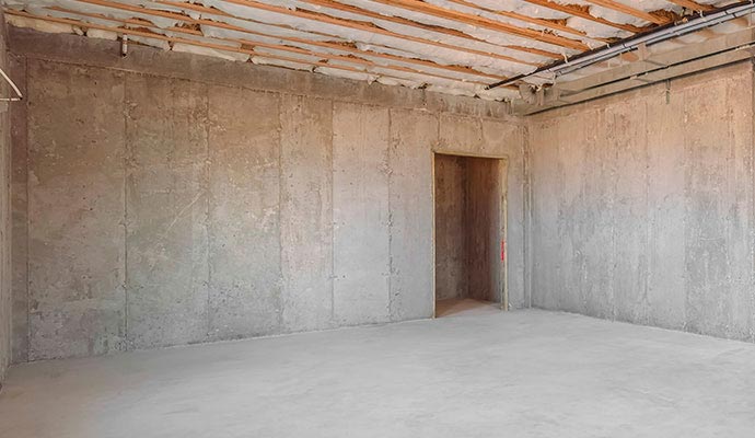 Unfinished concrete basement wall