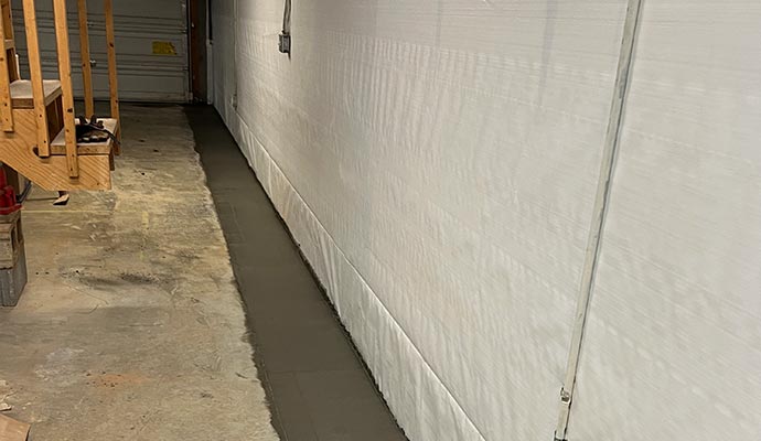 Vapor barrier system for basement waterproofing