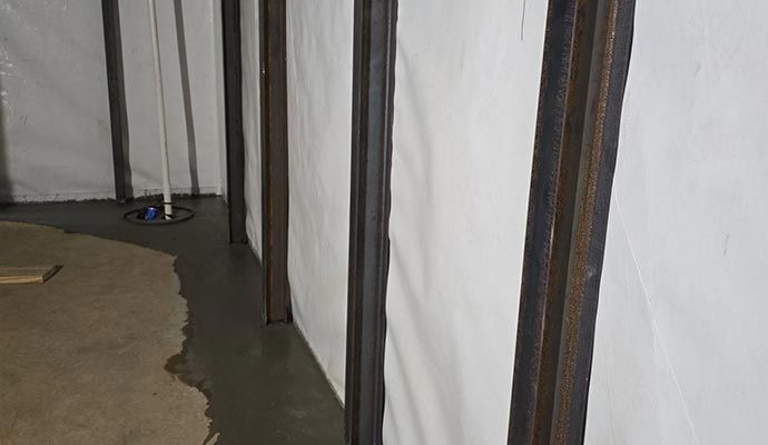 Water damaged foundation with steel beam support