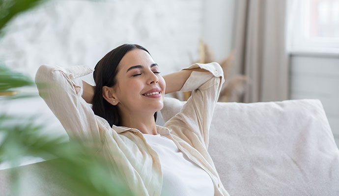 Woman relaxing in a fresh indoor environment